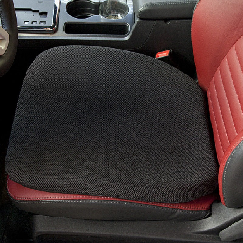 A close up image of a gel seat cushion on a leather car seat