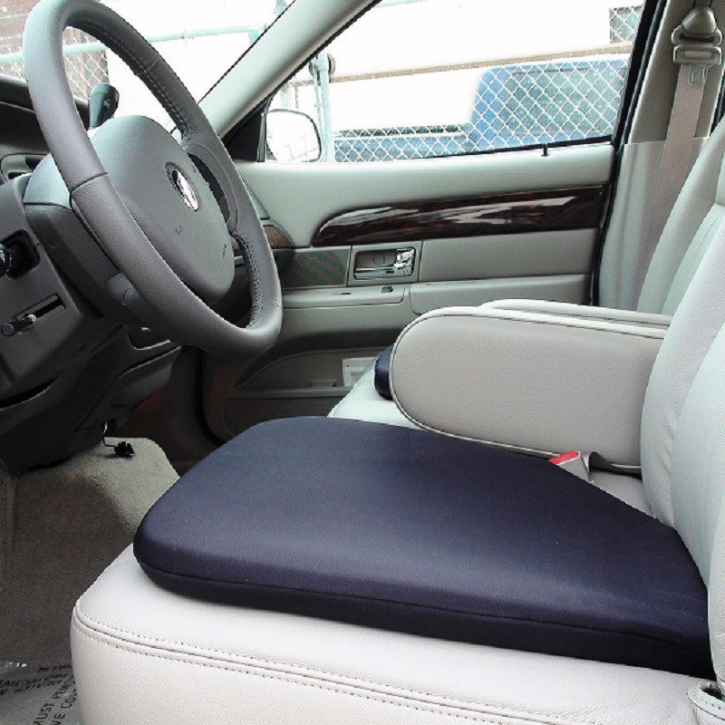 A comfortable gel seat cushion on top of the front seat in a car